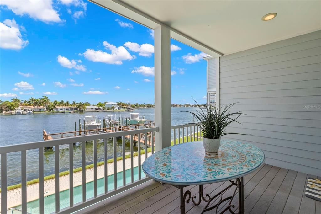 Step out onto your main floor balcony and embrace this serene southeast view. Whether you're dining al fresco or simply soaking up the sun, this space offers the perfect spot to enjoy the peaceful waterside setting.