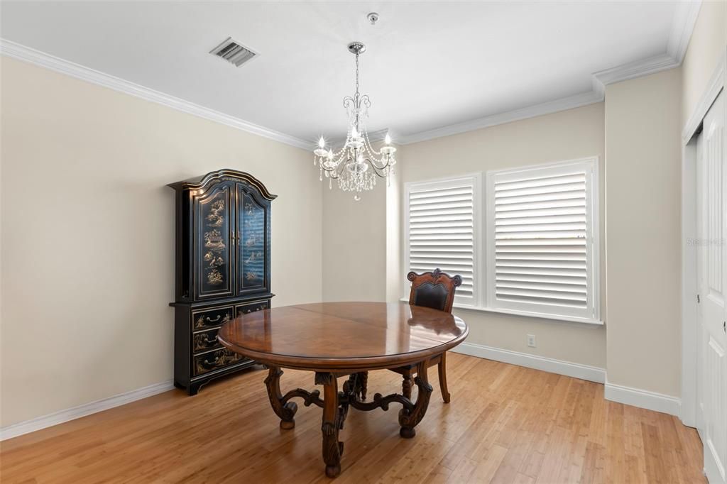 Versatility is key! This main-level room, currently used as a formal dining area, can easily transform into a third bedroom, home office, den, playroom, or craft room—whatever suits your lifestyle!