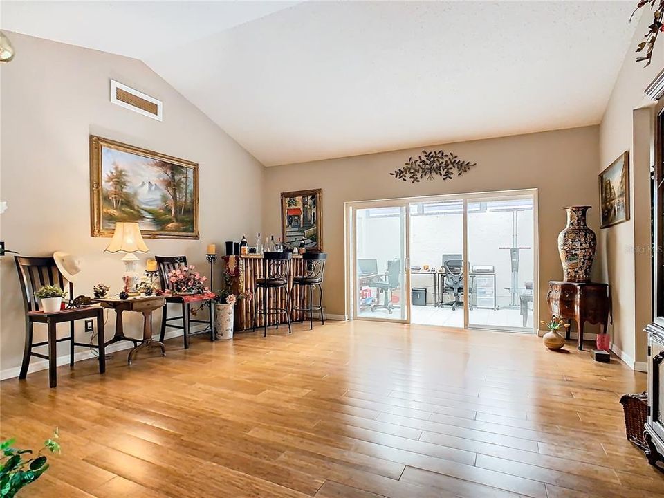 Formal living room with view into the additional bonus room