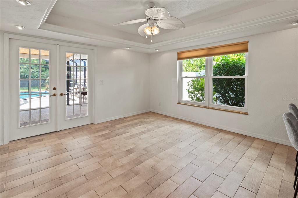 Large Dining Area overlooking outdoor pool and patio area.