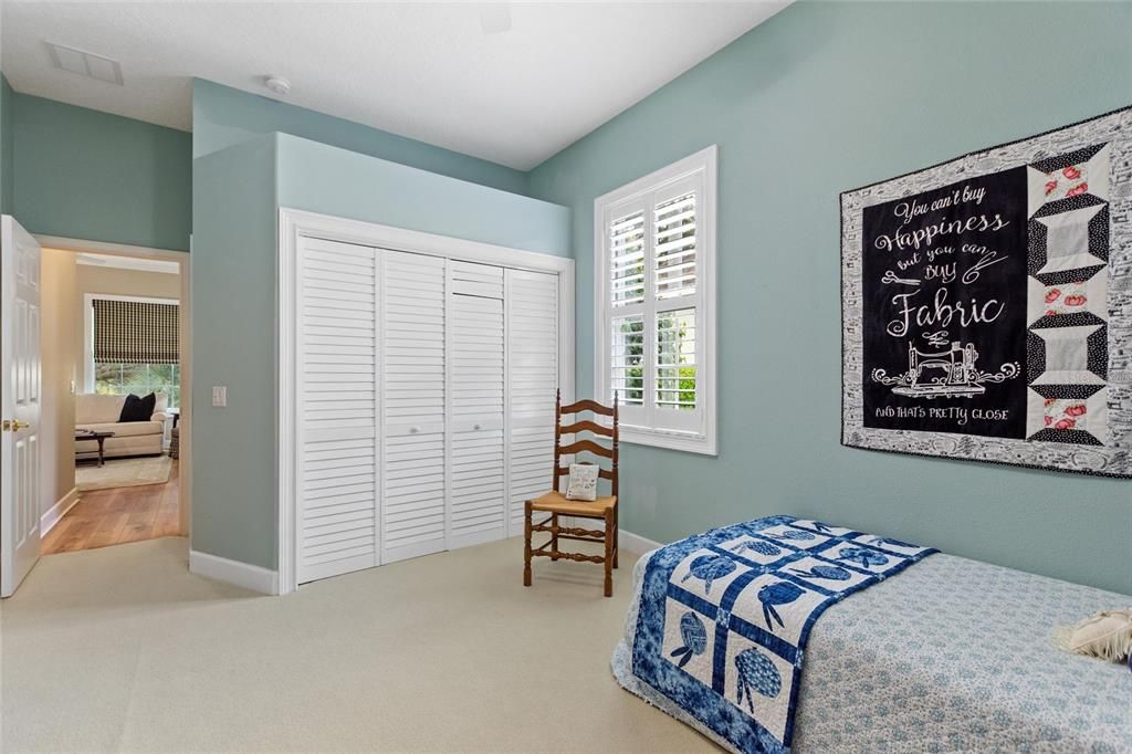 Lighted closet with custom built in shelves