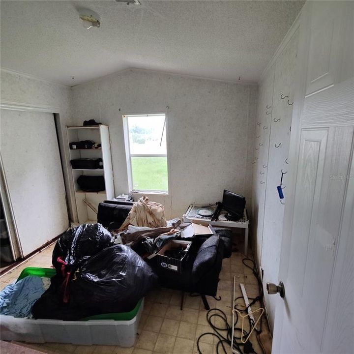 Primary bedroom in fairly good condition