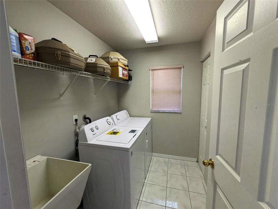 indoor laundry with wash tub