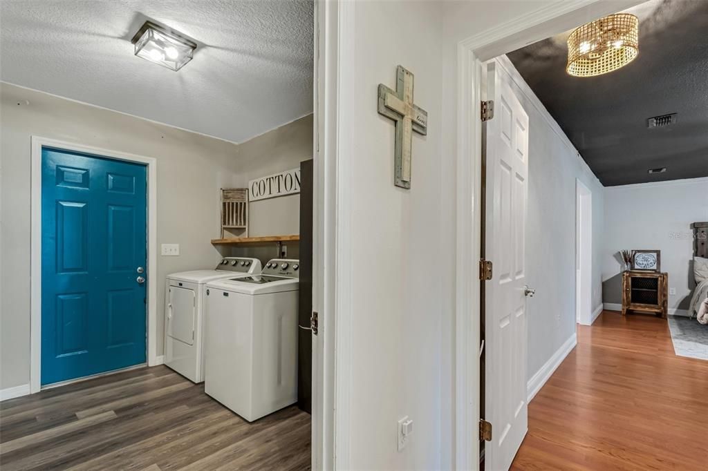 The laundry room and its entry into the garage. The washer & dryer convey with this home!