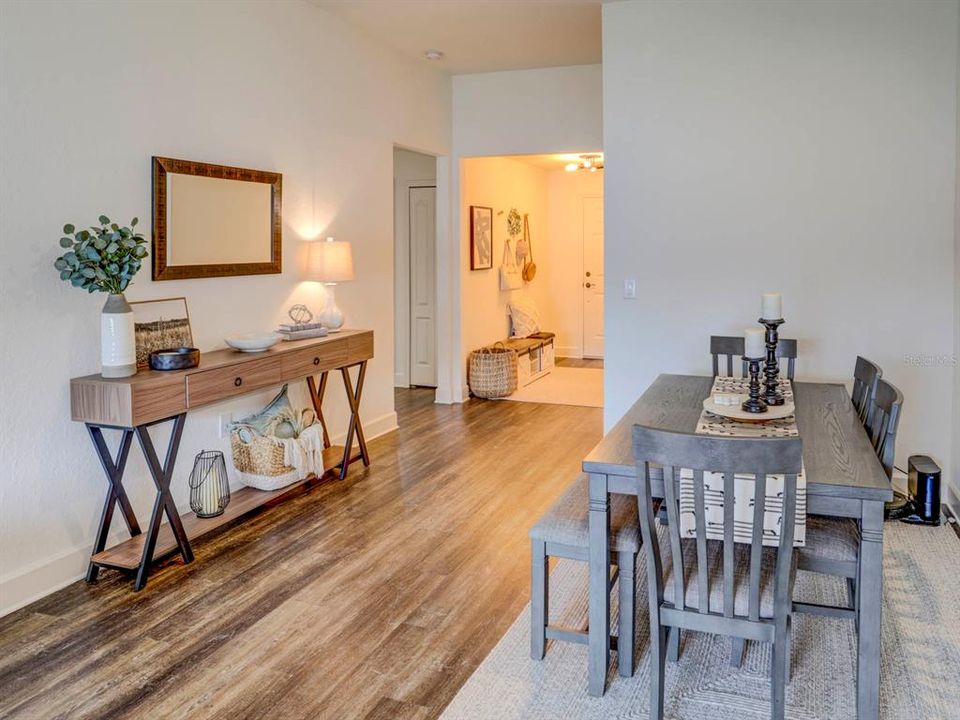 Entrance to the home with dining room. Luxury Vinyl Plank Floors.