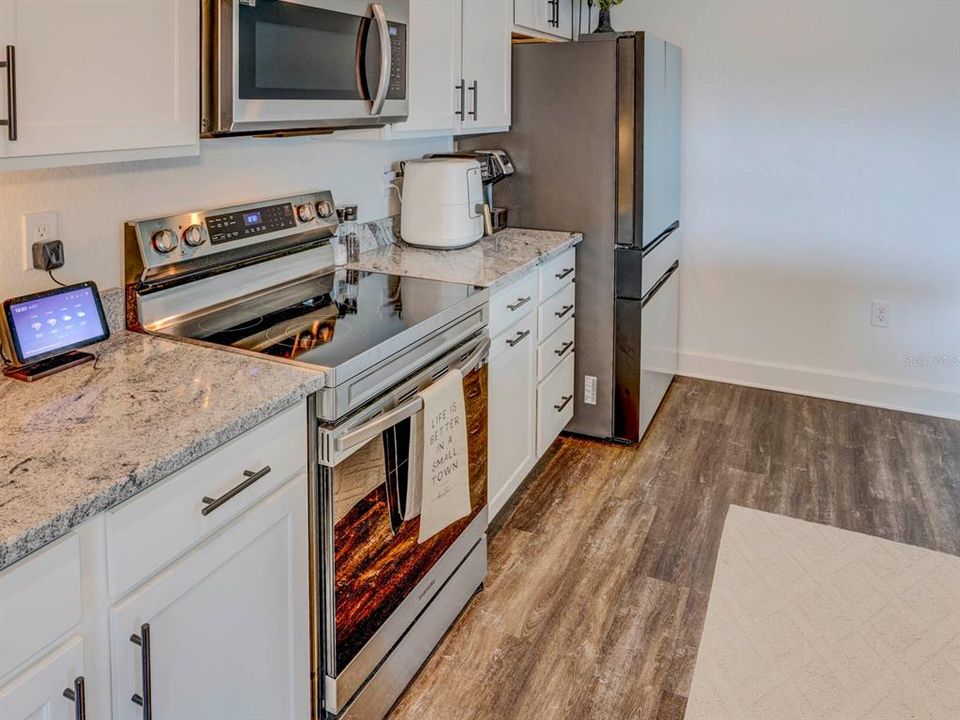 Kitchen area. Luxury Vinyl Plank Floors.