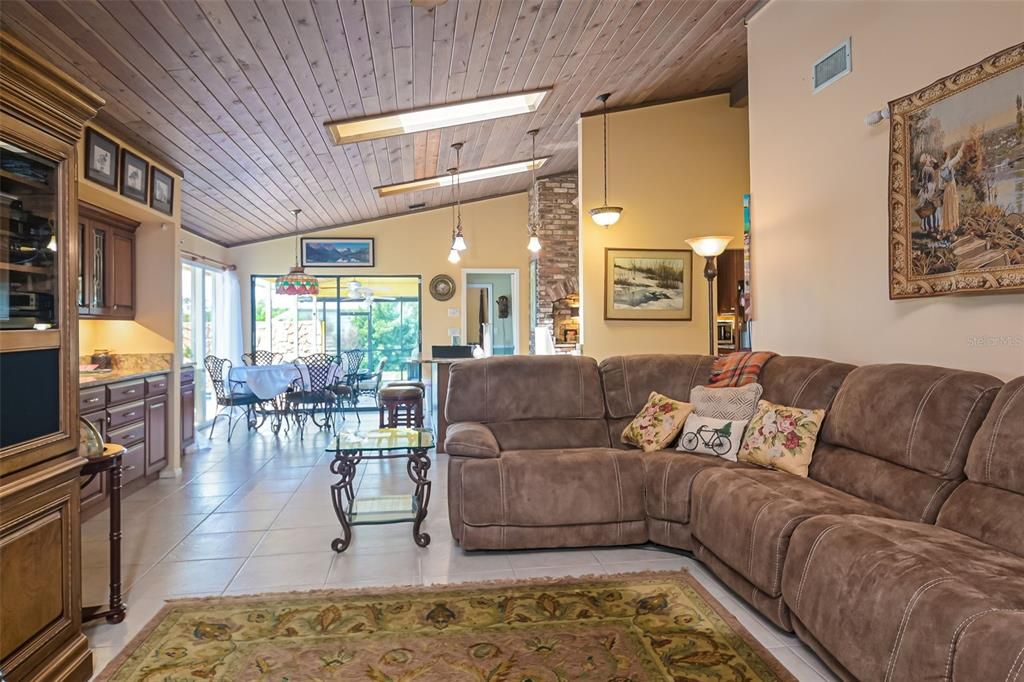 Living room with Skylights & stone fireplace