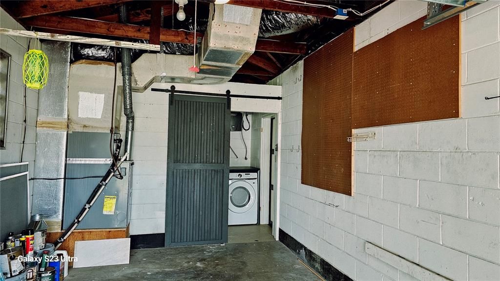 Garage, leading into laundry room and Lanai