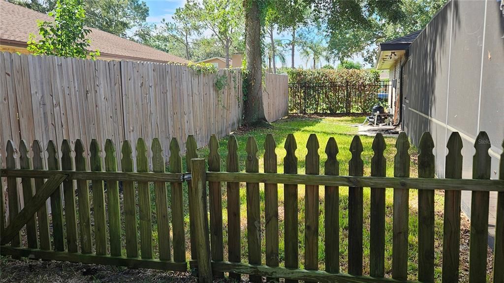 Dog run accessible from doggy door at the pool area