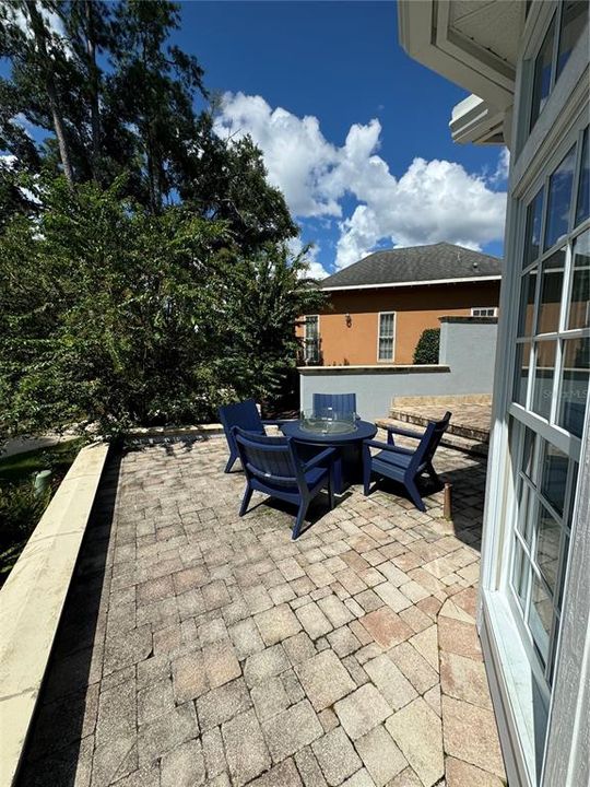 Large outdoor private patio area. Exterior landscape is maintained by the HOA. Irrigation is reclaimed water and maintained by the HOA. The backyard is a golf course. The front yard is the Haile Village Center Daylily Park.