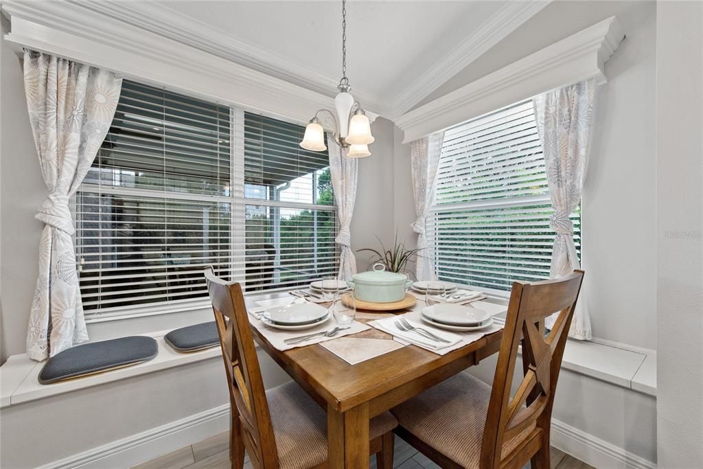 Wood and ceramic tile extendable table with 4 chairs.