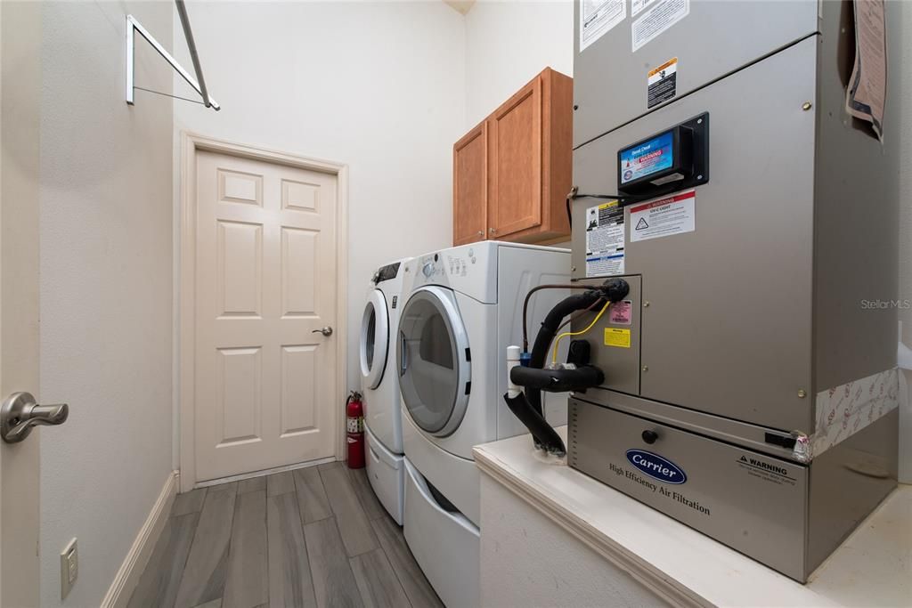 Inside Laundry with upper cabinets