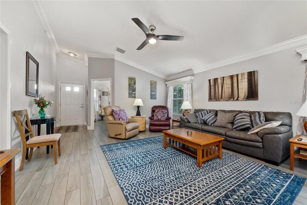 Leather couch and recliner chairs for generous living room seating.