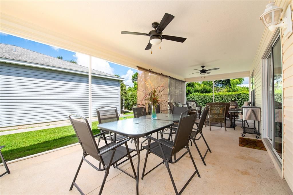 Oversized screened lanai accommodates outdoor dining and lounge areas for relaxation and entertainment.