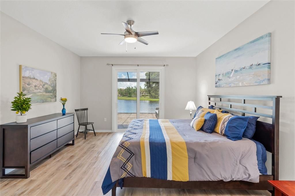 Primary Bedroom.  Opens to the extended lanai and the lake.