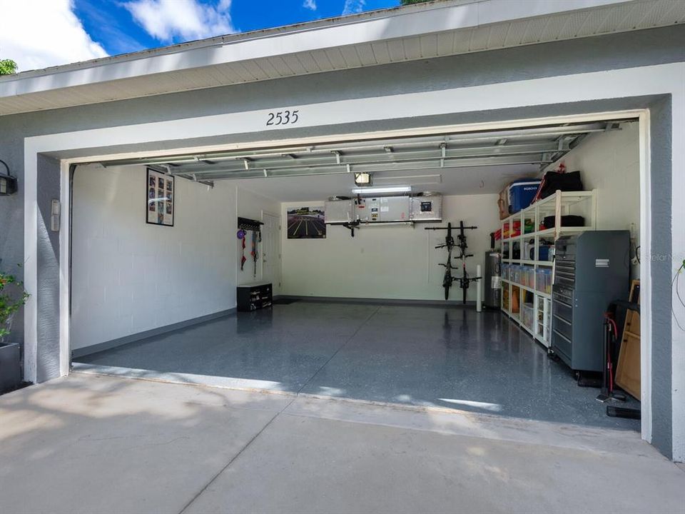 Spacious 2-Car Garage with epoxy coated flooring