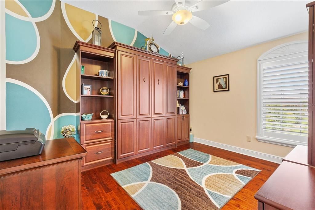 Middle Bedroom with Wall Bed and Matching Decor