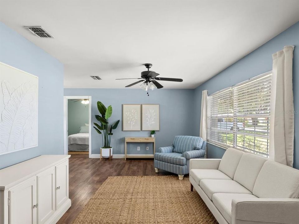 After walking into the front door, you are greeted by a large living space with ample natural lighting.