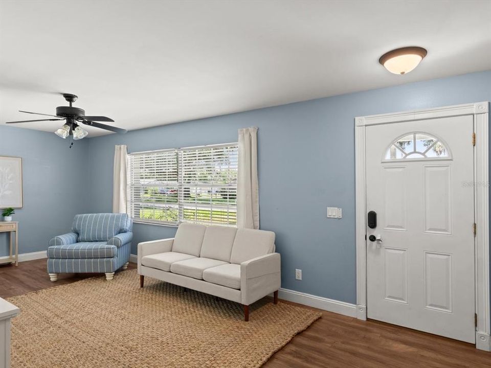 After walking into the front door, you are greeted by a large living space with ample natural lighting.