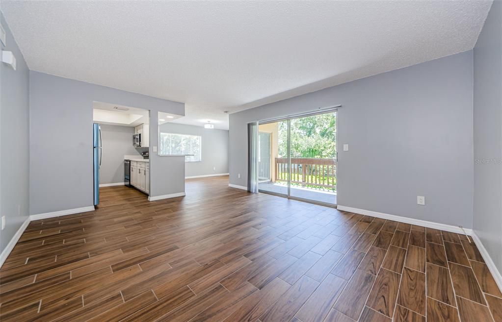 Living Room with new flooring and tons of natural light!