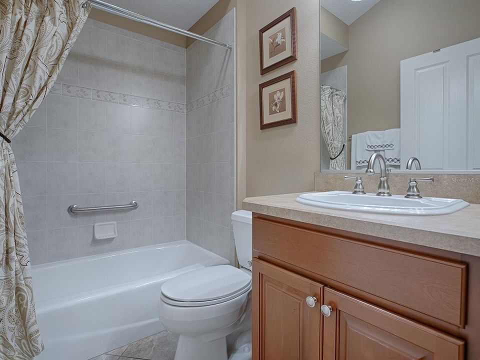 GUEST BATH WITH TUB/SHOWER.