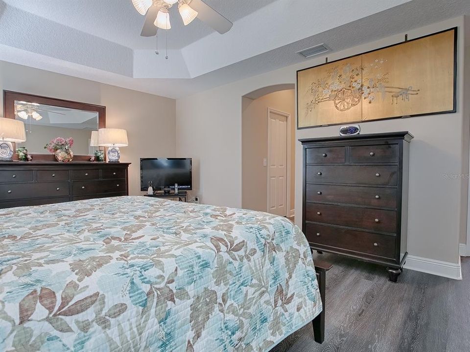 EN-SUITE BATH WITH 2 WALK-IN CLOSETS IN THE HALLWAY LEADING TO THE BATH.