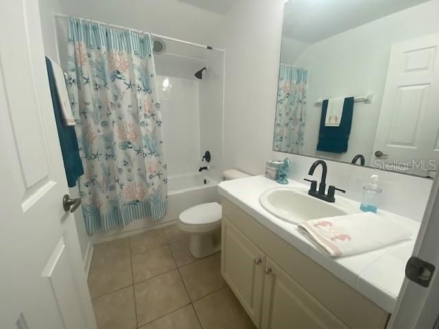 En-suite bathroom has a full shower/tub combo that has been glazed. New light fixture, sink, glazed counter, new faucets.