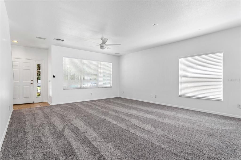 Large windows overlook the front porch. There is a separated small entrance.