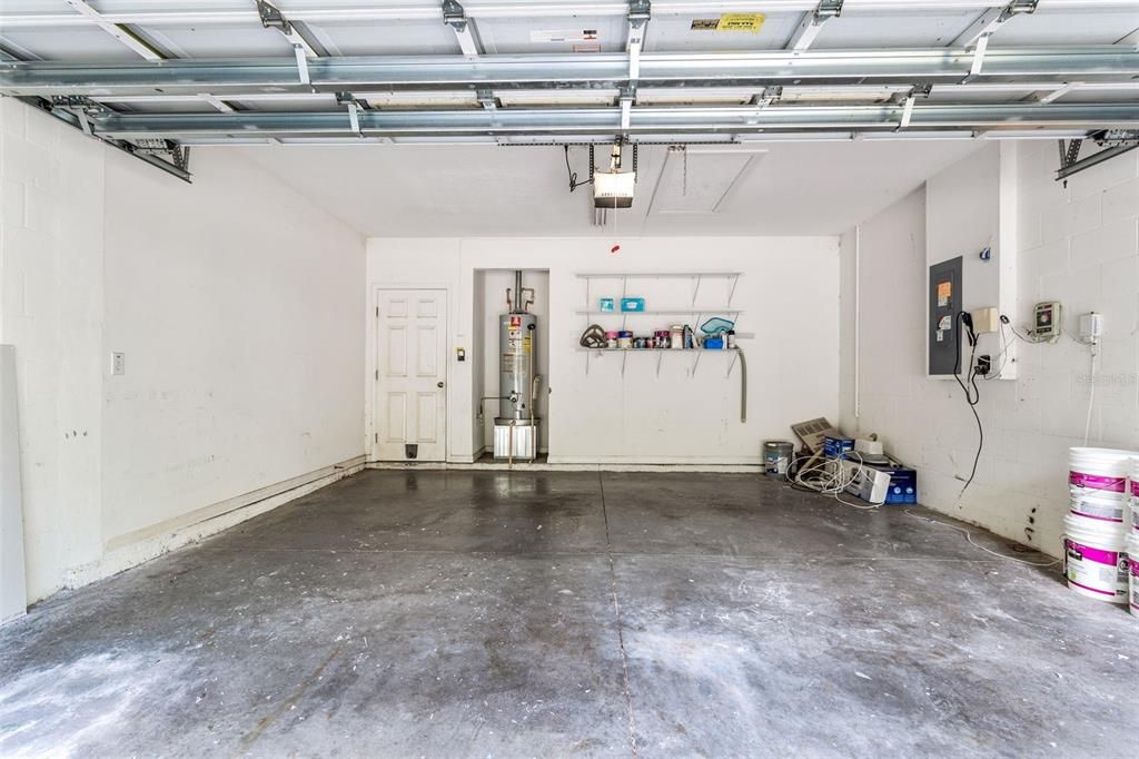 2 car garage with storage shelves. Automatic door opener.