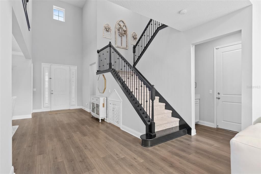 Foyer, stairs, and garage entrance