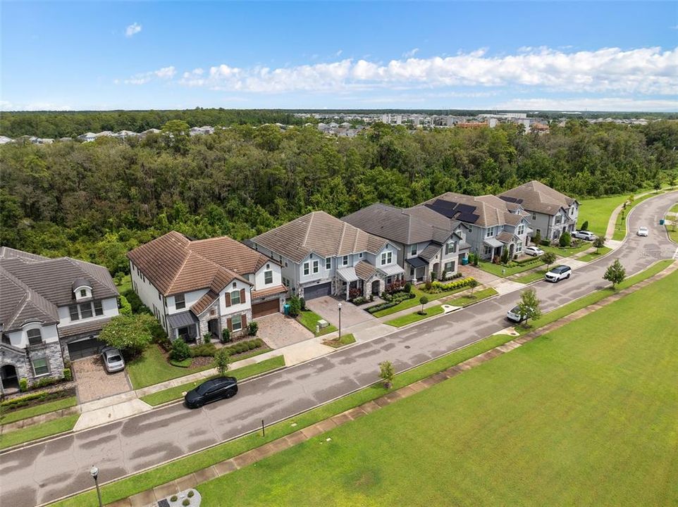 Aerial view of front of home with park in front yard