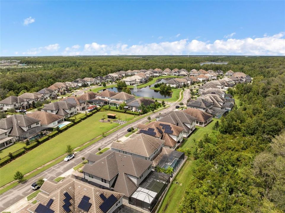 Aerial view of Belle Vie with park in front yard with downtown Orlando in the background