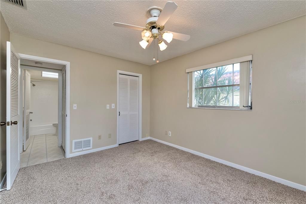 Guest bedroom with walk-in closet.