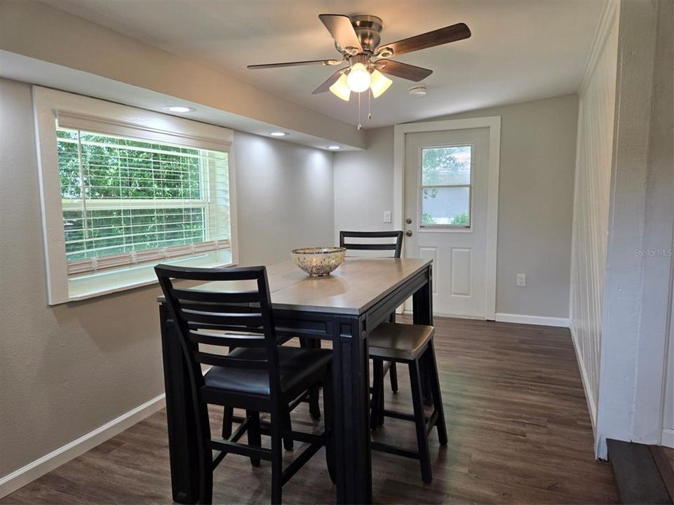 Beautiful, sunny Dining Room with recessed lighting