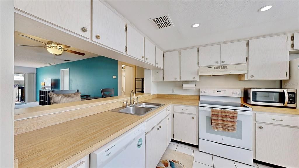 Cooks delight as kitchen overlooks dining and living room.