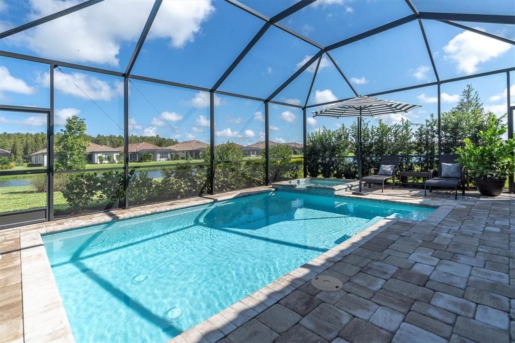 ENJOY YOUR HEATED POOL & SPA OVERLOOKING THE POND AND TREES