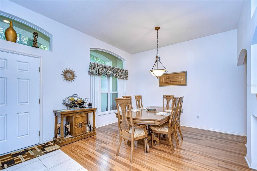 Bright & open formal dining room with hardwood floors!