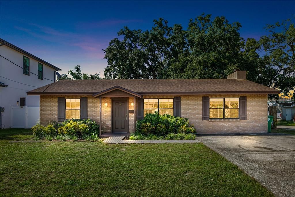 Nighttime curbside view of home