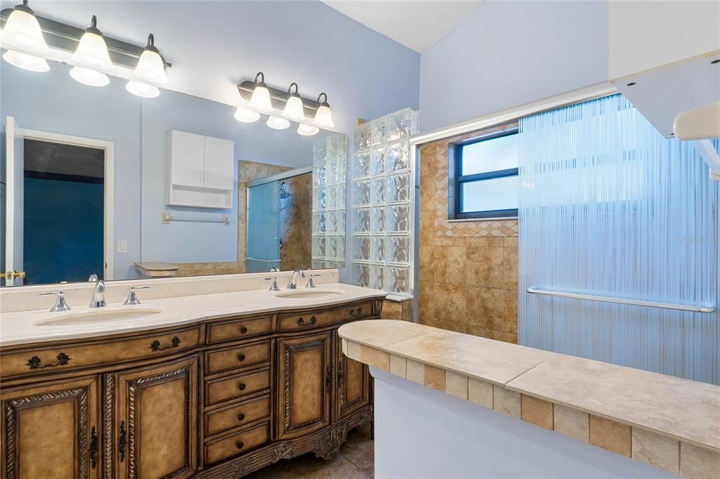 Dual vanities with a walk-in shower