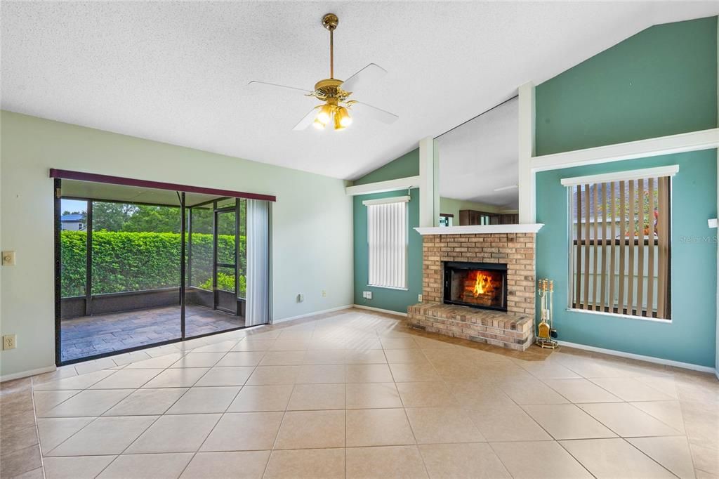 Family room with vaulted ceiling and fireplace