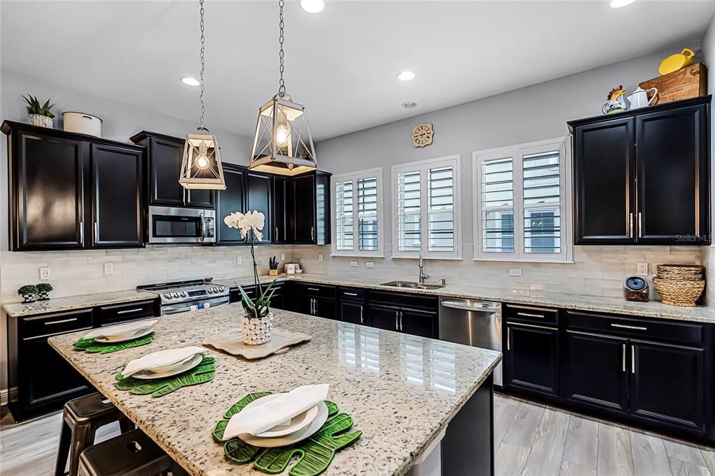 Large kitchen island with upgraded pendant lighting