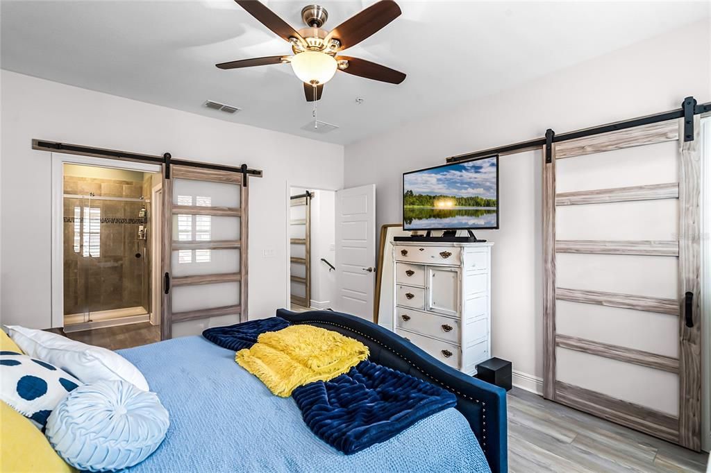 Primary bedroom with added modern barndoor to large closet