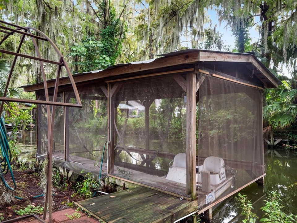 boat house with lift in the canal in front of guest house