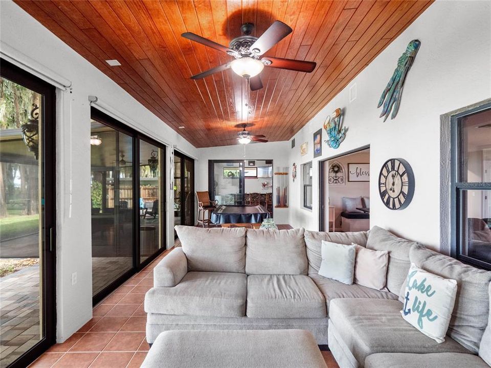 Florida room with wood ceilings