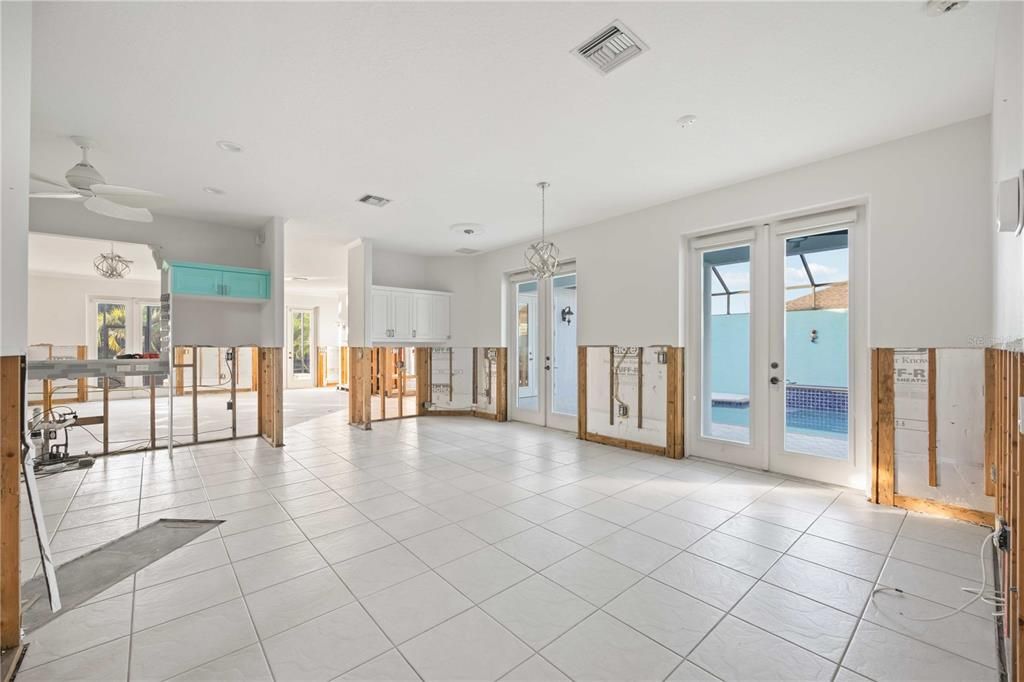 Expansive dining/kitchen/nook configuration. Space for in-home office, open kitchen, and double french doors to the courtyard.