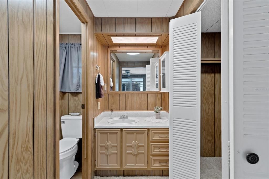 Primary Bathroom with Single Vanity and Private Water Closet