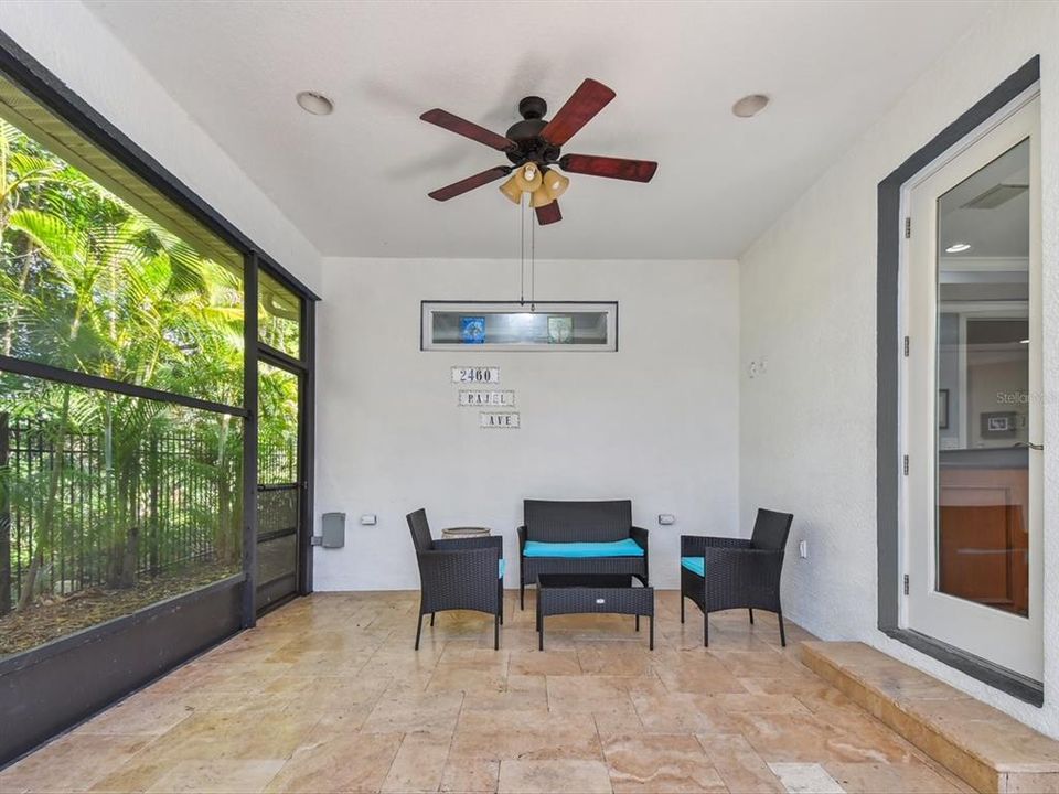 Beautiful travertine flooring throughout outdoor living space