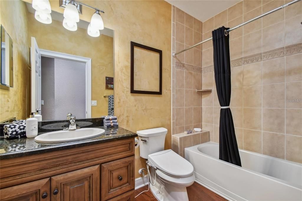 Hall bath between 2 bedrooms with tub shower combo