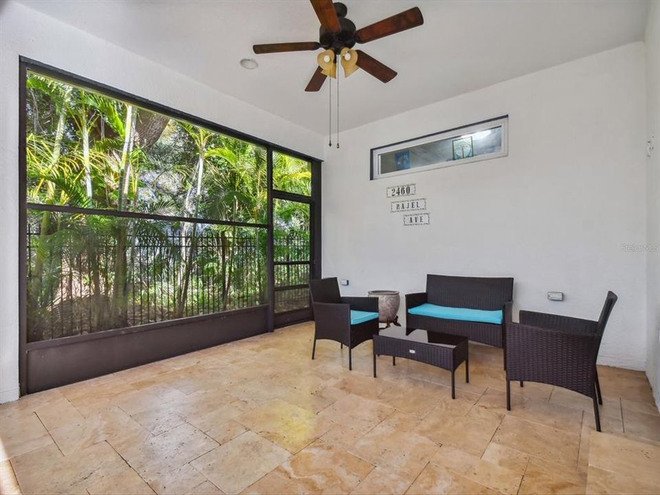 Covered lanai area with plenty of space for indoor/outdoor furniture