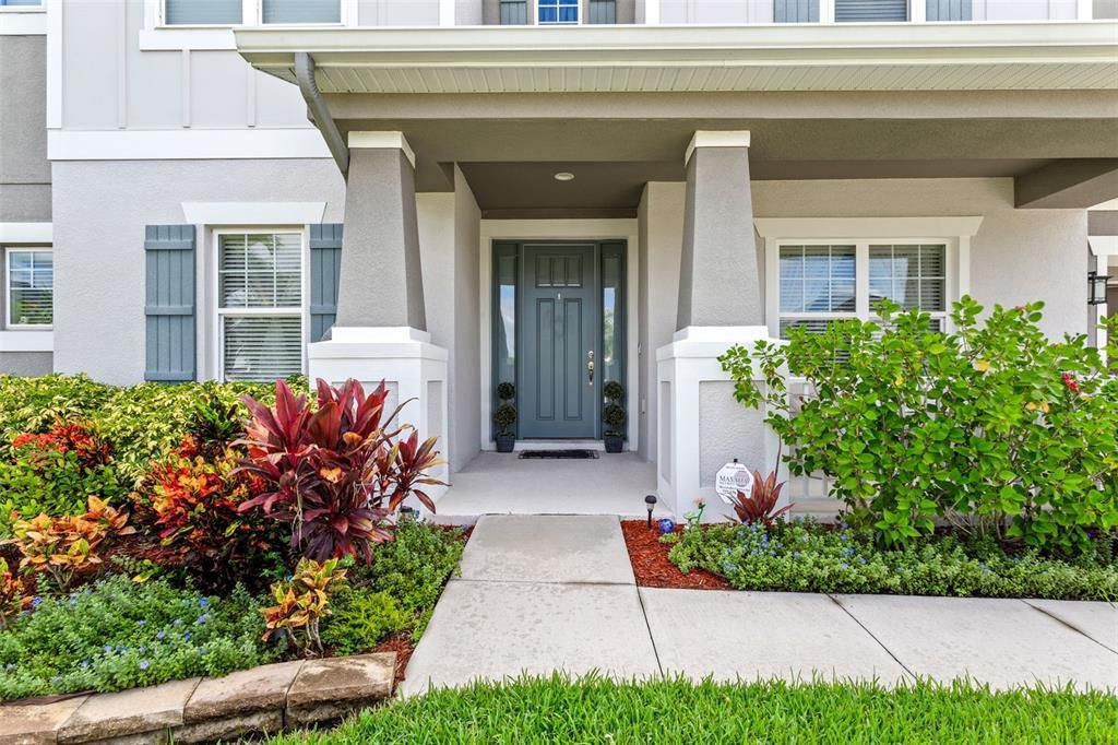 Enter into your new home flanked by lush landscaping meticulously kept.